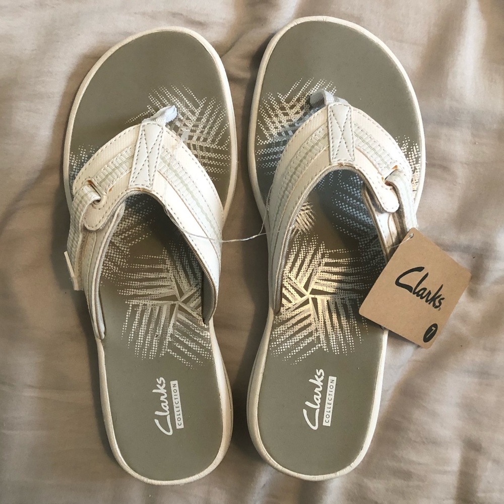 White adjustable Clark flip flops
